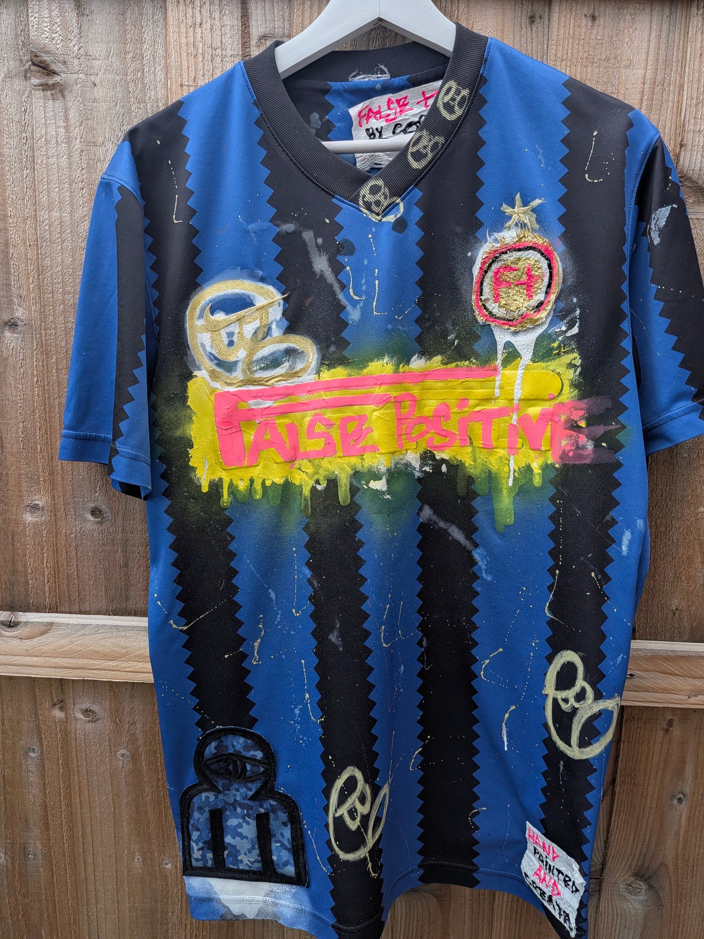 False Positive by Core Sway Hand Painted & Upcycled Football Shirt